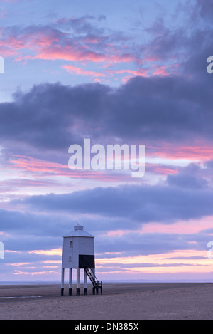 Sunset beyond wooden lighthouse at Burnham-on-Sea, Somerset, England. Autumn (September) 2013. Stock Photo