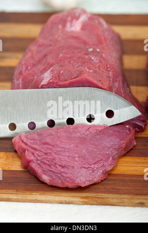 raw beef cutting on wood board ready to cook Stock Photo