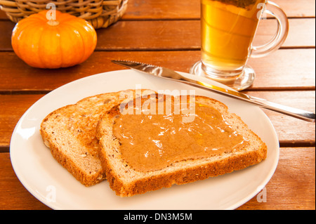 Two slices of multigrain toast with cashew butter and tea Stock Photo