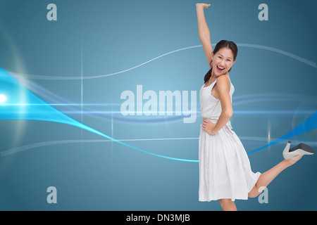 Composite image of happy and classy brunette posing Stock Photo