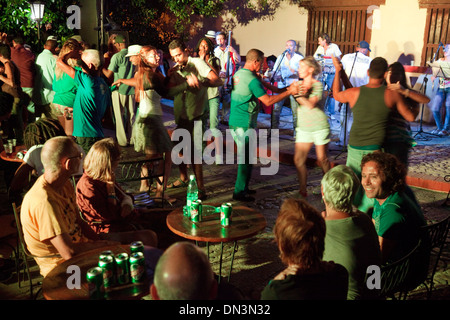 Cubans and tourists salsa dancing  late at night in an outdoor bar and nightclub, Trinidad, Cuba Caribbean Latin America. Stock Photo