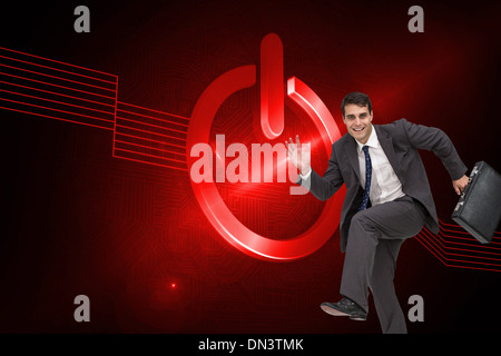 Composite image of happy businessman in a hury Stock Photo