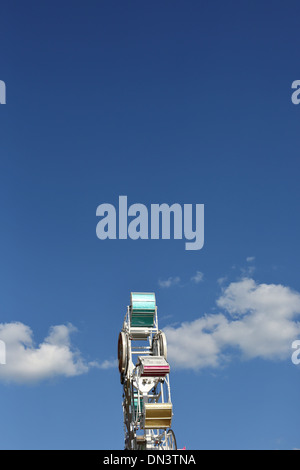 A carnival ride called the Zipper, against a blue sky. Stock Photo