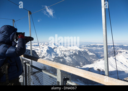 photographing from the deck of the Sphinx Observatory, Jungfraujoch, Switzerland Stock Photo