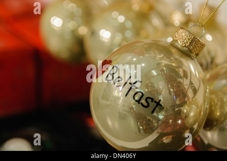 A christmas tree baubel with 'Belfast' on sale in Visit Belfast tourist information centre Stock Photo