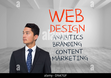 Composite image of serious asian businessman Stock Photo