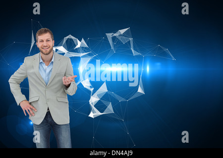 Composite image of stylish man smiling and gesturing Stock Photo