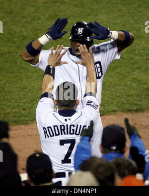 Detroit Tigers Craig Monroe is congratulated by teammate Curtis