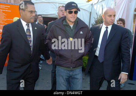 Nov 03, 2006; MANHATTAN, NY, USA; LANCE ARMSTRONG (C) exits the press conference. Lance Armstrong, seven time Tour de France winner, hosts a press conference to discuss his participation in the 2006 New York City Marathon. Armstrong says he plans to run the marathon in under three hours and will be surrounded by former marathon champions Alberto Salazar and Joan Benoit Samuelson as Stock Photo