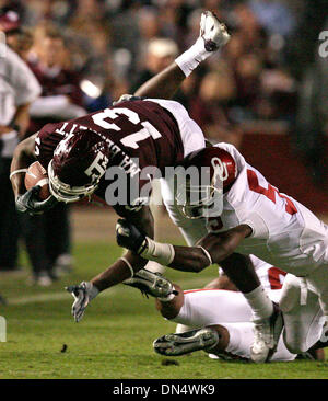 Nov 04, 2006; College Station, TX, USA; A&M's Martellus Bennett gets triped up by Oklahoma tackler Nic Harris after a reception in the second quarter Saturday at Kyle Field.   Mandatory Credit: Photo by Tom Reel/San Antonio Express-News/ZUMA Press. (©) Copyright 2006 by San Antonio Express-News Stock Photo
