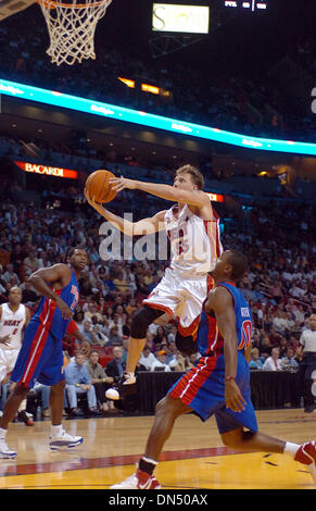 Nov 30, 2006; Miami, FL, USA; Miami Heat guard Jason Williams (55) drives to the basket as Detroit Pistons forward Antonio McDyess (24),left, and Detroit Pistons guard Lindsey Hunter (10) both look on during the first quarter at the American Airlines Area Thursday, Nov.30. 2006, in Miami. Mandatory Credit: Photo by Steve Mitchell/Palm Beach Post/ZUMA Press. (©) Copyright 2006 by Pa Stock Photo