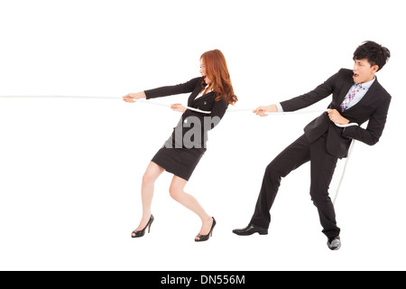 business man and woman playing tug of war Stock Photo