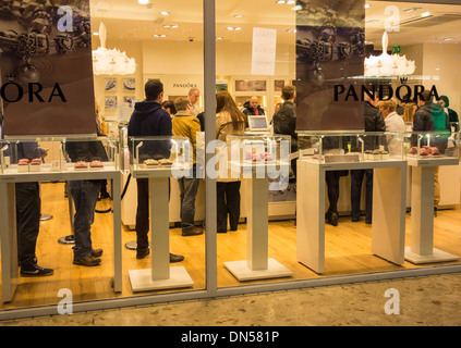 People queuing in Pandora shop at Christmas. UK Stock Photo