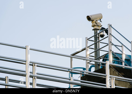 Old security camera on the fence Stock Photo