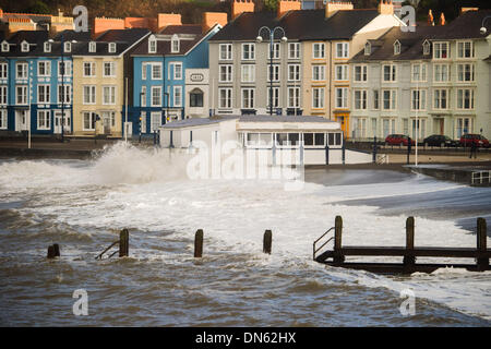 Aberystwyth Wales UK, Thursday 19 December 2013  At the peak of the tide, 8.40am, just after daybreak,  strong winds bring massive waves crashing onto the seafront at Aberystwyth on the west Wales coast.  Further bands of wet and windy weather are forecast to sweep in from the Atlantic over the next few days  Photo Credit: keith morris/Alamy Live News Stock Photo