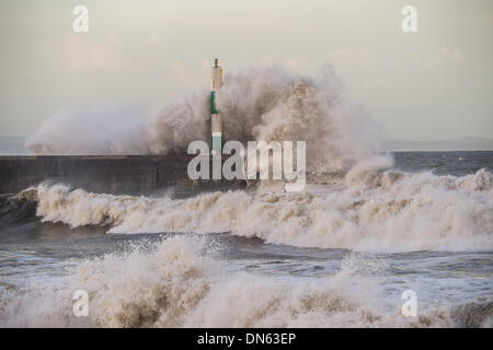 Aberystwyth Wales UK, Thursday 19 December 2013  At the peak of the tide, 8.40am, just after daybreak,  strong winds bring massive waves crashing onto the seafront at Aberystwyth on the west Wales coast.  Further bands of wet and windy weather are forecast to sweep in from the Atlantic over the next few days  Photo Credit: keith morris/Alamy Live News Stock Photo