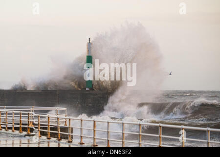 Aberystwyth Wales UK, Thursday 19 December 2013  At the peak of the tide, 8.40am, just after daybreak,  strong winds bring massive waves crashing onto the seafront at Aberystwyth on the west Wales coast.  Further bands of wet and windy weather are forecast to sweep in from the Atlantic over the next few days  Photo Credit: keith morris/Alamy Live News Stock Photo