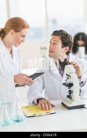 Scientists working in laboratory Stock Photo