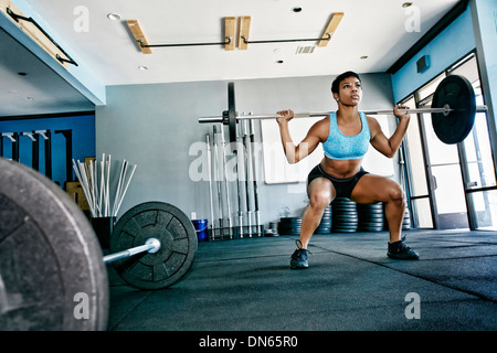 Black woman working out in gym Stock Photo