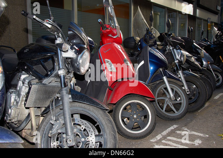 motor cycles parked in a motor bike bay Stock Photo
