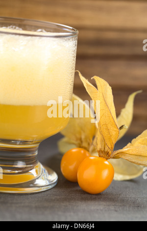 Physalis berries (lat. Physalis peruviana) with a Peruvian cocktail called Aguaymanto Sour (Physalis Sour) Stock Photo