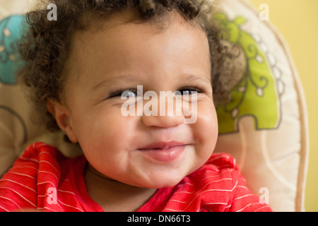 Mixed race toddler boy smiling