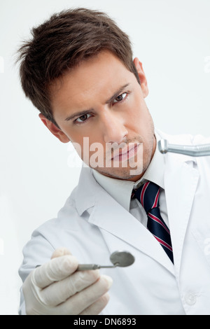 Dentist Holding Angled Mirror And Drill Stock Photo - Alamy