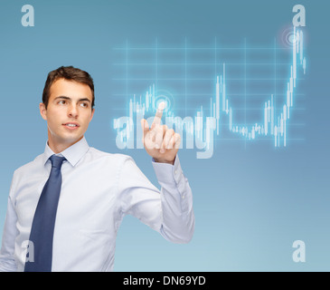 man working with forex chart on virtual screen Stock Photo