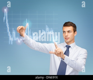man working with forex chart on virtual screen Stock Photo