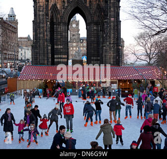 19 Dec. 2013, Edinburgh Christmas Ice Rink, Princes Street Gardens, Scotland, UK. Families and teenagers appear to be enjoying skating on a bright afternoon a week before Christmas Stock Photo