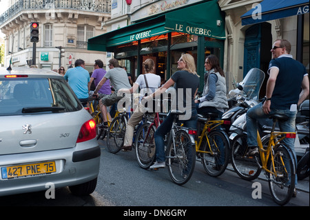Paris, France, Group Young Tourists Cycling on Street on Bicycle Tour in streets of Paris 'Saint Germain des Pres' District, women biking outside