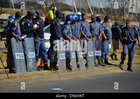 Armed South African police officers of the JMPD with riot shields. Stock Photo