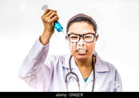 Angry crazy asian doctor with a syringe Stock Photo