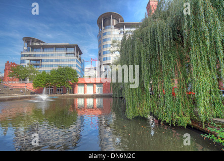 Wide angle shot of Bridgewater Hall & 101 Barbirolli Square Manchester, England UK with canal basin reflections Stock Photo