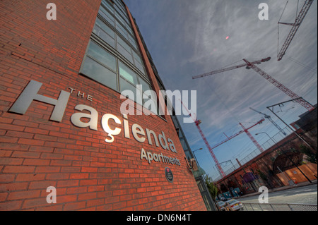 The Haçienda Apartments on Whitworth Street West, Manchester, with construction cranes rising behind the former FAC51 site. Stock Photo