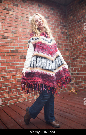 Young blond girl wearing alpaca woolen poncho made in Bolivia, South Stock Photo - Alamy
