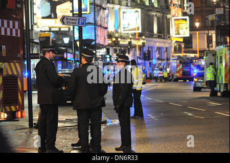 Shaftsbury Avenue, London, UK. 19th December 2013. Police and Fire Brigade officers at the scene of the Apollo Theatre collapse. At least 80 people were injured in the incident. Credit:  Matthew Chattle/Alamy Live News Stock Photo