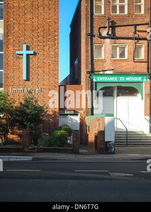 Emmanuel Church next door to the entrance to Jami Mosque in Southsea Portsmouth. Stock Photo