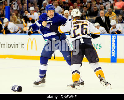 Tampa, Florida, USA. 19th Dec, 2013. DIRK SHADD | Times .Tampa Bay Lightning right wing B.J. Crombeen (19) drops the gloves and fights against Nashville Predators center Matt Hendricks (26) during first period action at the Times Forum in Tampa Thursday evening (12/19/13) Credit:  Dirk Shadd/Tampa Bay Times/ZUMAPRESS.com/Alamy Live News Stock Photo