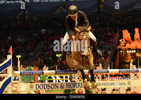 London, UK. 19th December 2013. London International Horse Show 2013. Horse jumping competition for the Raymond Brooks-Ward Memorial Trophy at Kensington Olympia in London, 19th Dec 2013, Photo by See Li/Alamy Live News Stock Photo