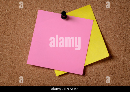 two reminders sticky note on cork board, empty space for text Stock Photo