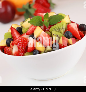 Summer fruit salad with strawberries, kiwi, blueberries and peaches Stock Photo