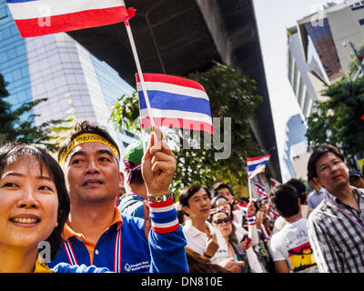 Bangkok, Thailand. 20th Dec, 2013. Anti-government protestors gather on Silom Road. Thousands of anti-government protestors, supporters of the so called Peoples Democratic Reform Committee (PRDC), jammed the Silom area, the ''Wall Street'' of Bangkok, Friday as a part of the ongoing protests against the caretaker government of Yingluck Shinawatra. Yingluck dissolved the Thai Parliament earlier this month and called for national elections on Feb. 2, 2014. Credit:  ZUMA Press, Inc./Alamy Live News Stock Photo