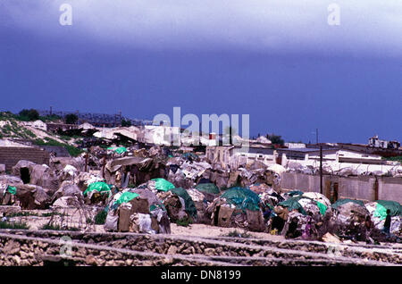 Nov. 30, 1993 - Mogadishu, Somalia - Displaced camp on the outskirts of Mogadishu showing igloo styled huts made with plastic bags and sticks. (Credit Image: © Theodore Liasi/ZUMAPRESS.com) Stock Photo
