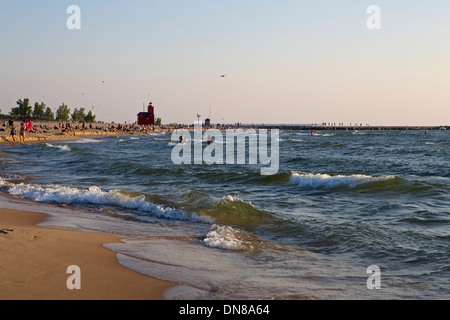 The beach at Holland State Park with the Big Red lighthouse in the distance Stock Photo