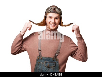 Handsome welcoming man smiling - isolated over a white background and posing in vintage helmet and glasses pilot. Stock Photo