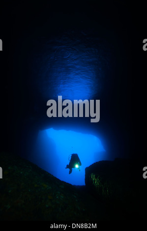 Scuba diver in a cave. Stock Photo