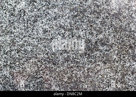 natural stone granite wall with rough structure. Stock Photo