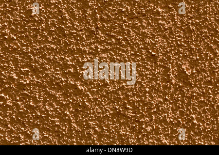 old rough brown rendered wall background Stock Photo - Alamy