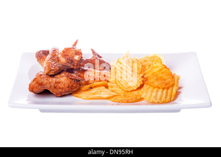Grilled chicken wings with potato chips isolated on white background Stock Photo